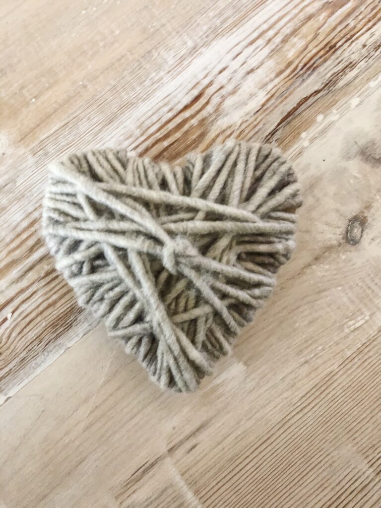 yarn wrapped heart in neutral color