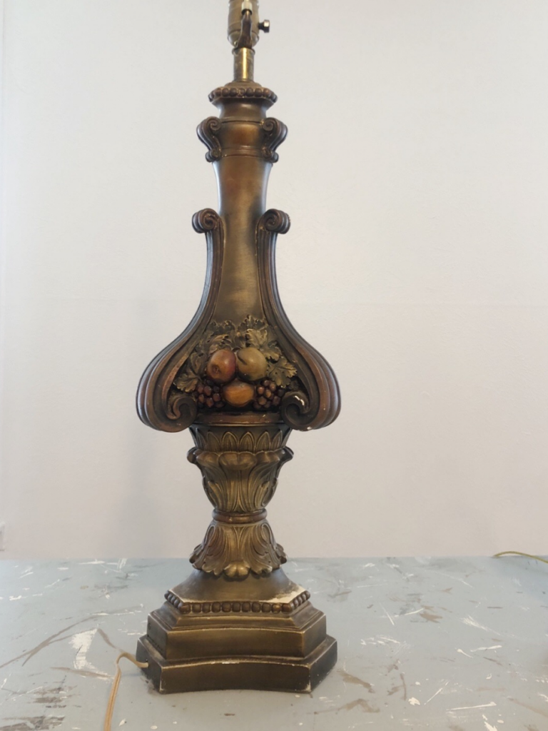 thrifted lamp base dark color with fruit pattern