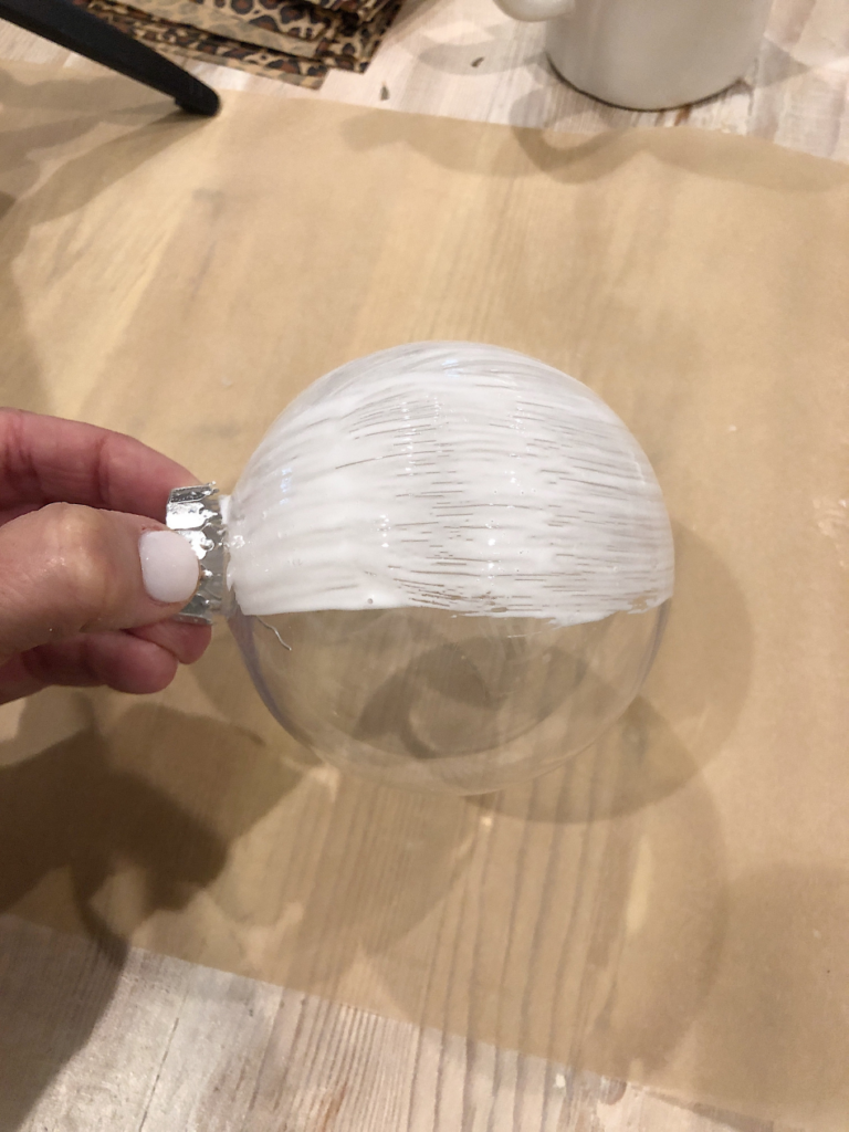 clear plastic ball ornament covered with mod podge