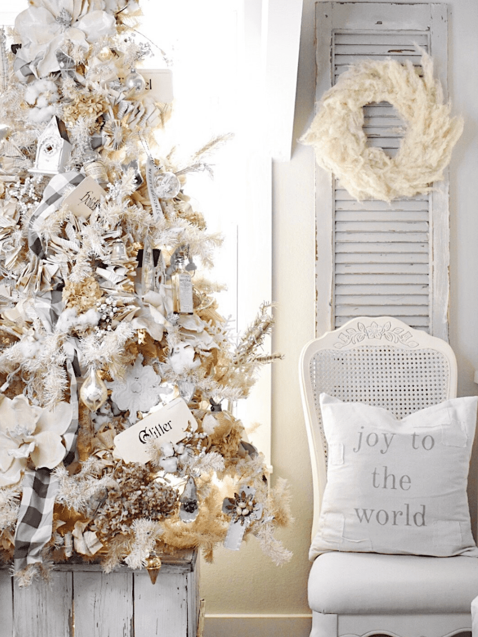 white vintage christmas tree decorated in all neutral vintage decorations