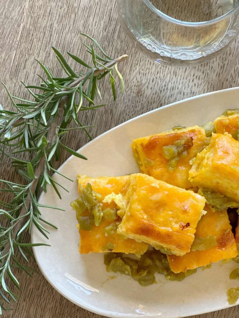 white oval platter filled with easy green chile cheese fudge squares