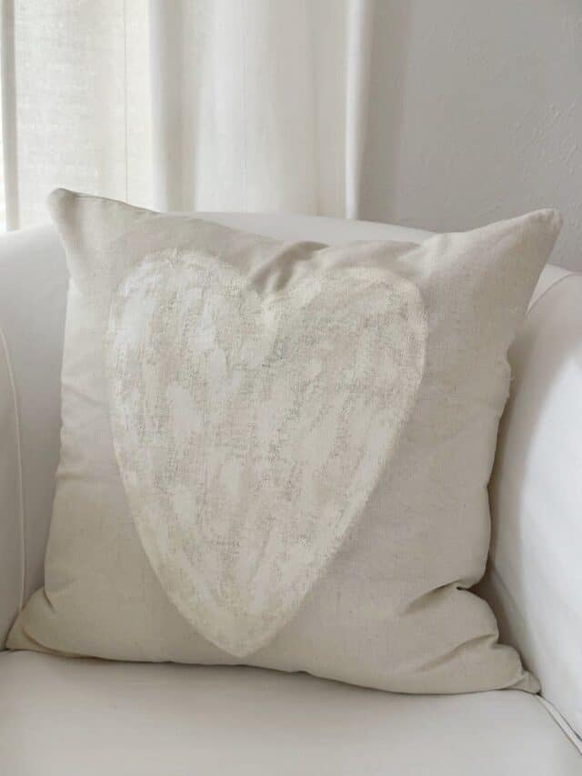 linen pillow cover with white heart painted on