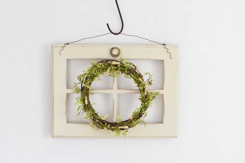 handmade spring wreath on white window pane display